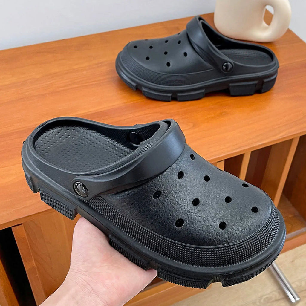 Black rubber unisex lightweight eva garden clogs with thick textured sole and ventilation holes for beach and yard use