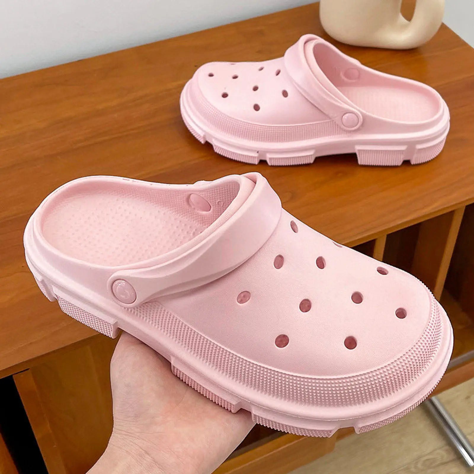 Pink unisex lightweight eva garden clogs with circular perforations and textured sole for beach and casual wear