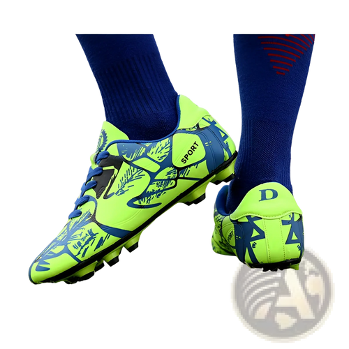 Unisex neon graphic low top soccer cleats with vibrant neon green and blue leafy pattern and black laces for all terrains