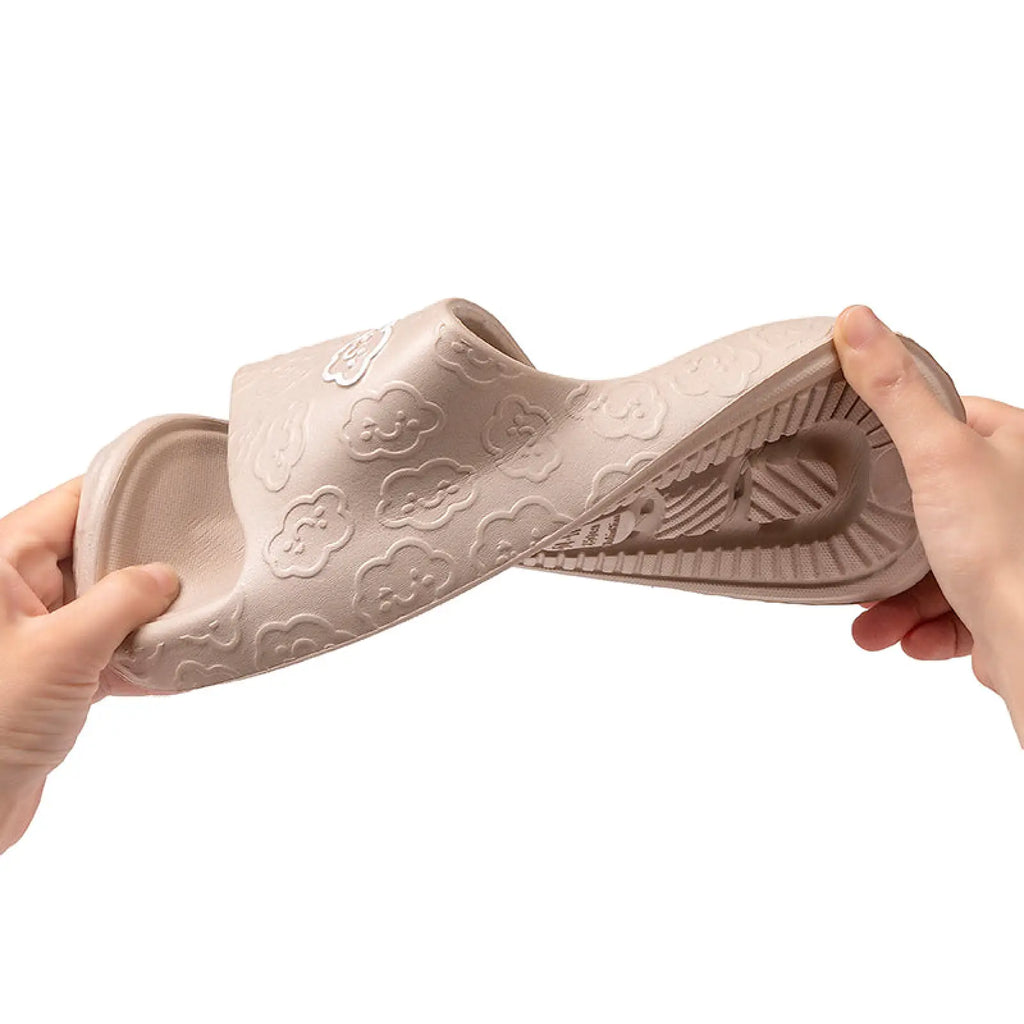 Beige unisex non slip EVA rubber slide sandal with embossed cloud patterns and textured sole for indoor and outdoor use