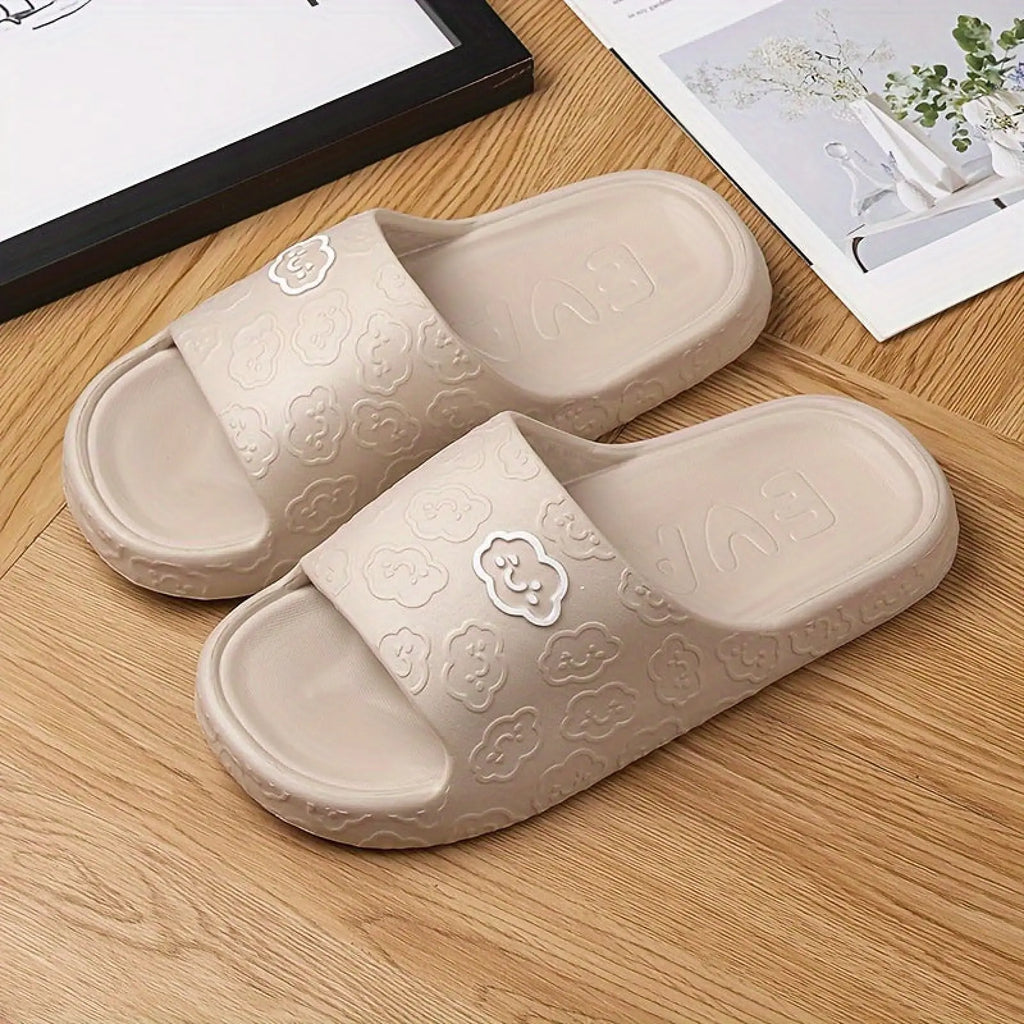 Beige rubber unisex non slip eva cloud slides with embossed cloud patterns and smiling bear emblem on strap for indoor and outdoor use