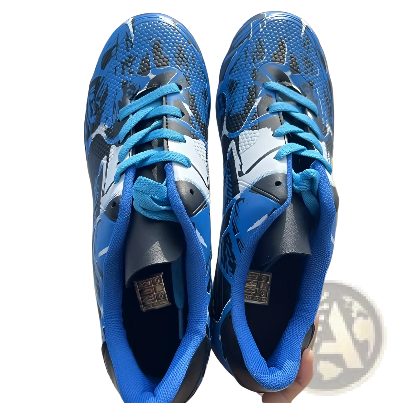 Unisex professional low top soccer cleats and training shoes in blue and black with bright blue laces and mesh upper material
