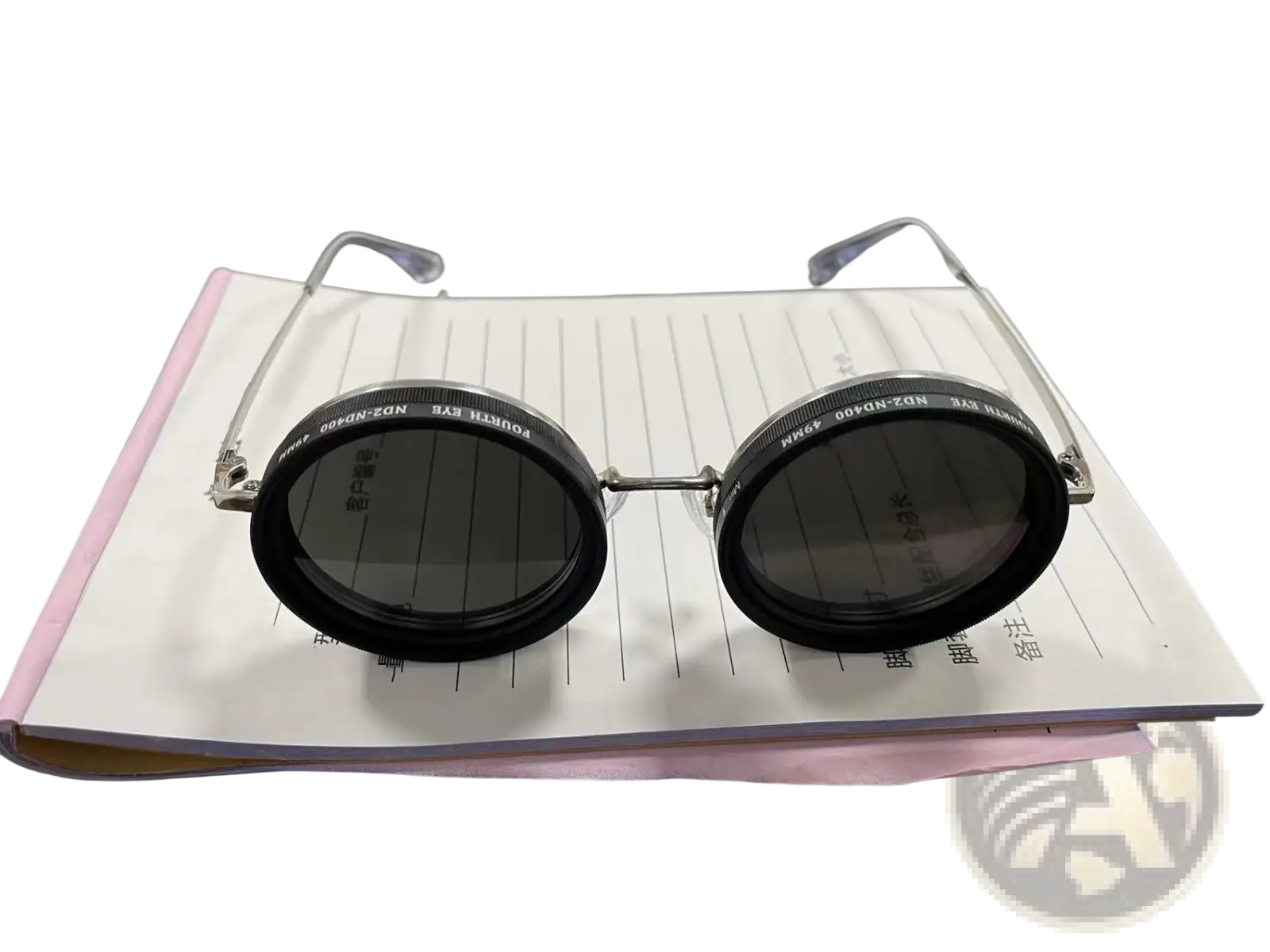 Unisex round uv resistant sunglasses with steampunk black circular frames, dark gray lenses, and silver metal temples