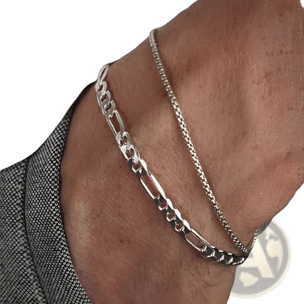 Unisex silver layered Cuban and figaro link bracelet set featuring a bold figaro and finer curb-link design anklet