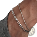 Unisex silver layered Cuban and figaro link bracelet set featuring a bold figaro and finer curb-link design anklet