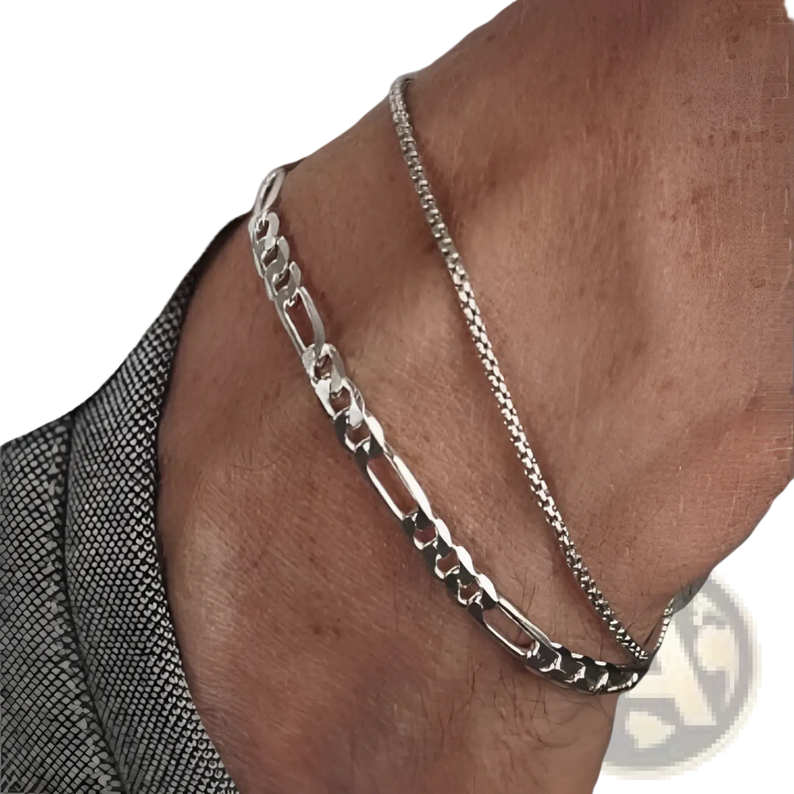 Unisex silver layered Cuban and figaro link bracelet set featuring a bold figaro and finer curb-link design anklet