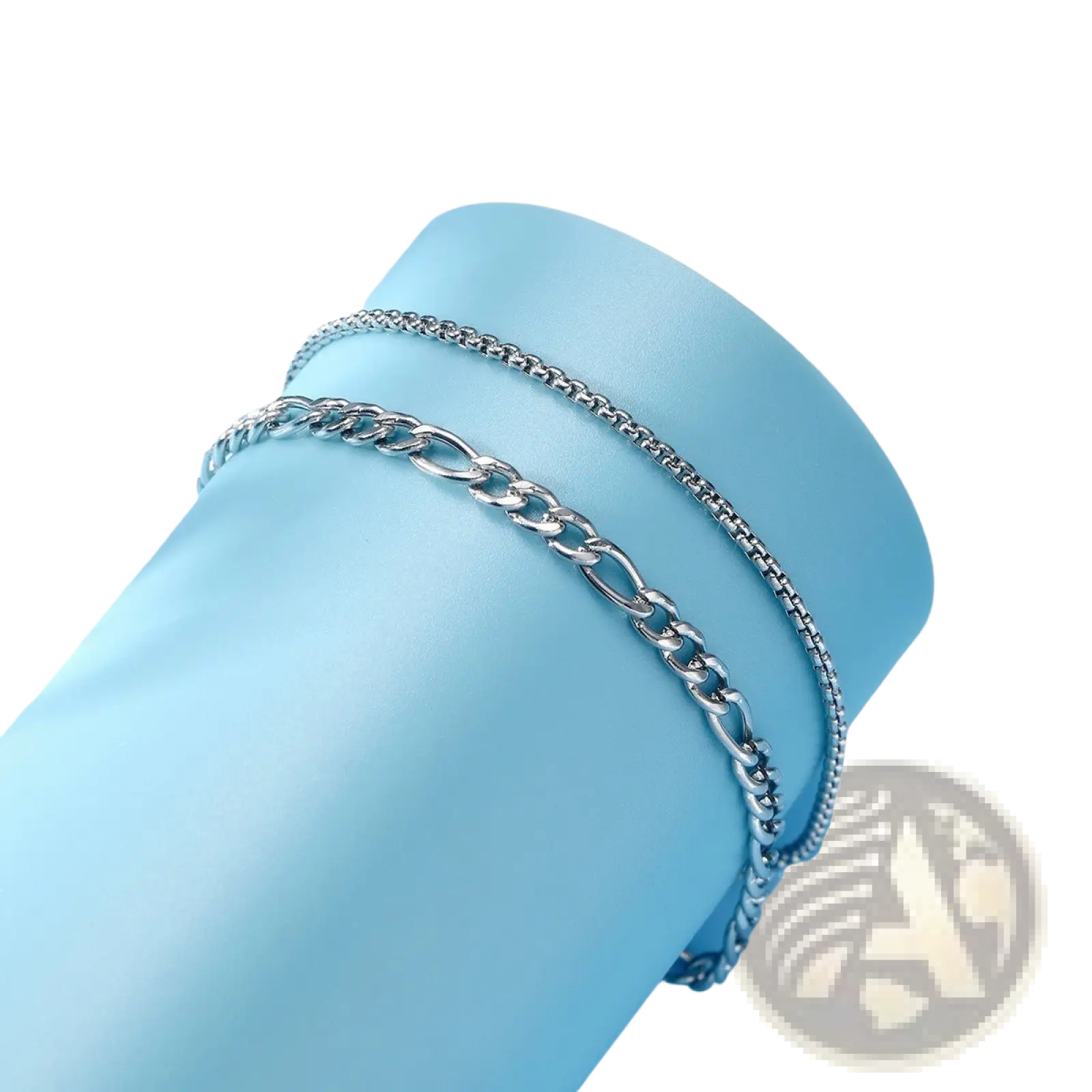 Unisex silver layered Cuban and Figaro link bracelet set featuring a silver-toned stainless steel chain anklet with interlocking links