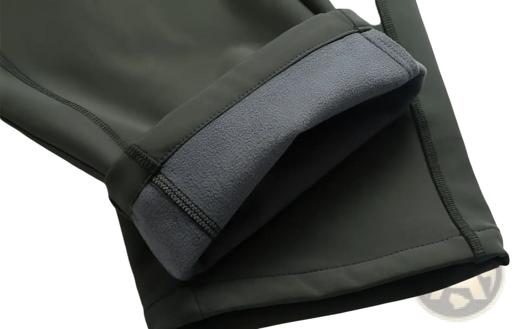 Unisex tactical outdoor hiking pants in olive green with gray fleece lining waterproof material and reinforced stitching