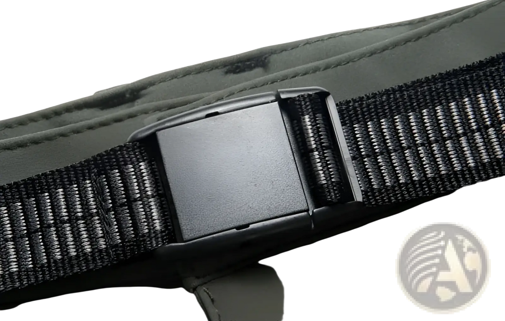 Black woven strap with matte black plastic buckle on unisex tactical outdoor hiking pants with accent zippers