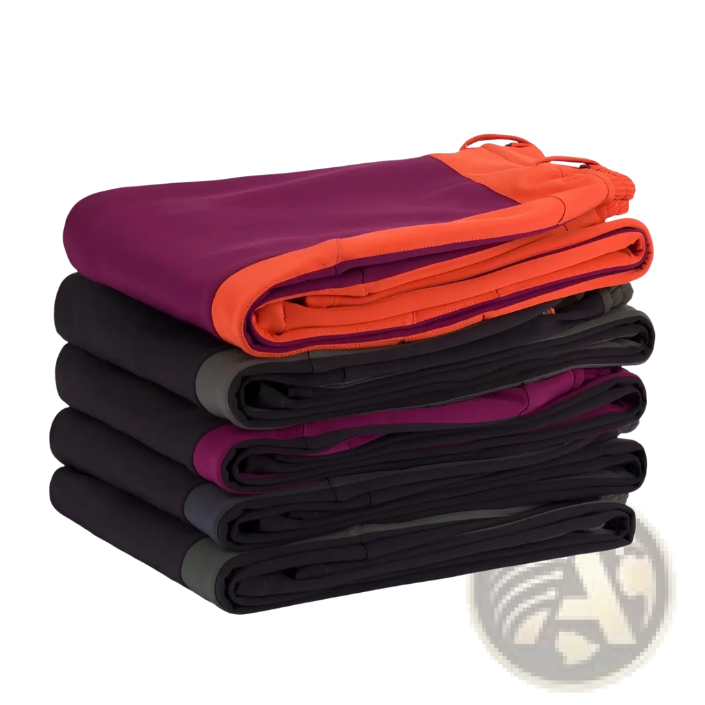 Stack of folded unisex tactical outdoor hiking pants in vibrant purple orange and black with accent zippers