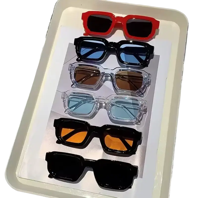 A set of six unisex trendy futuristic rectangle sunglasses in vibrant red, glossy black, and transparent frames with tinted lenses