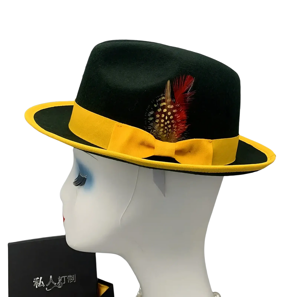 Unisex black woolen felt fedora hat with bright yellow ribbon band and decorative red and white feather accent
