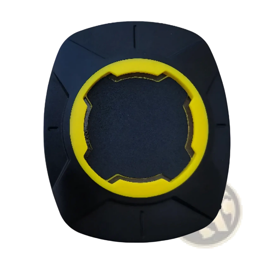 Black and yellow rubber universal phone mount patch for bicycle handlebars with textured grip surface