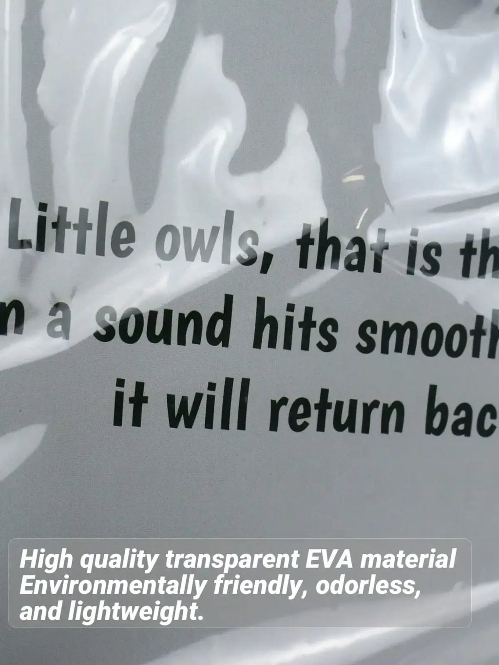 Universal transparent baby stroller rain cover made of glossy transparent eva material with printed text on packaging