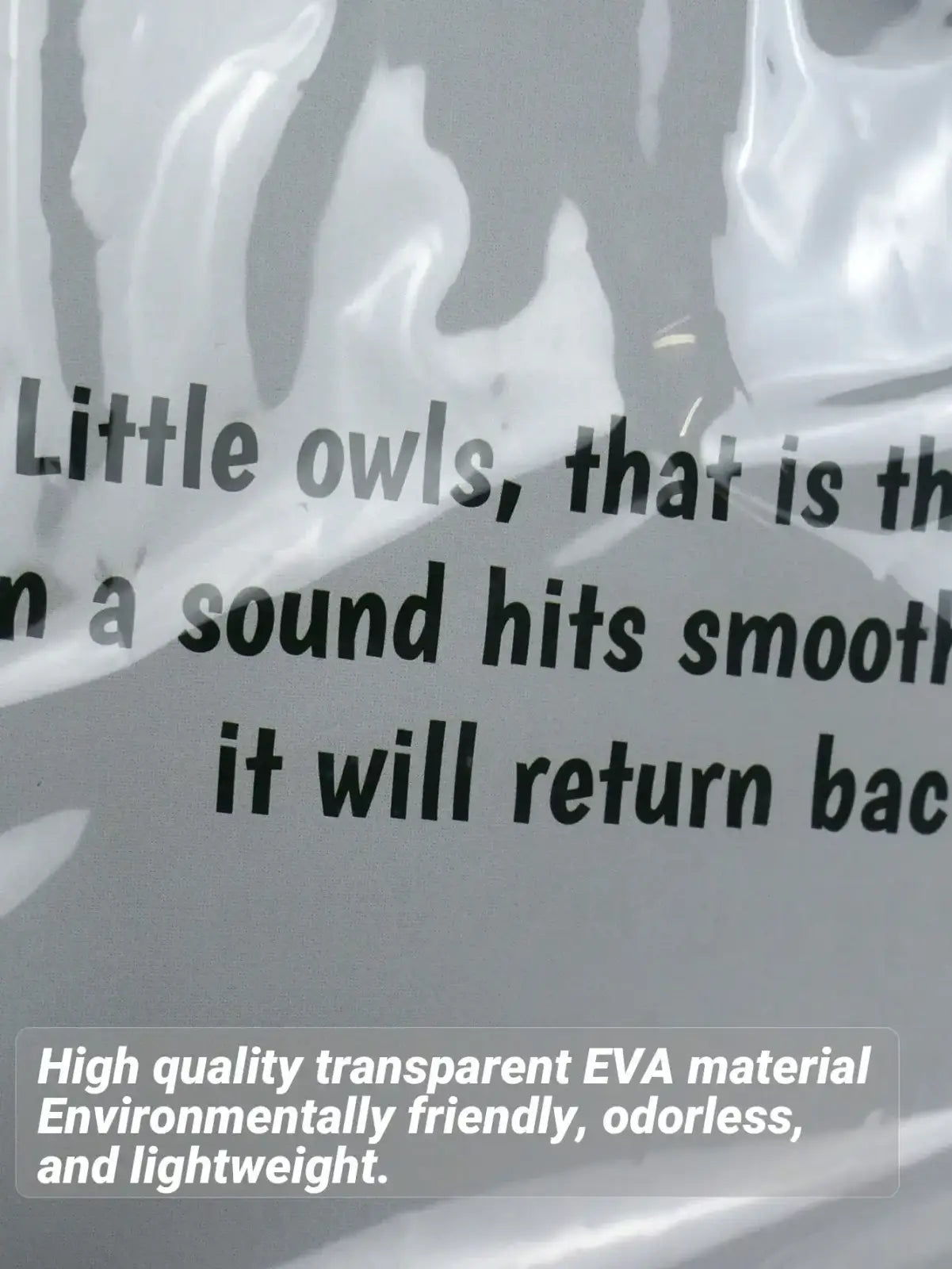 Universal transparent baby stroller rain cover made of glossy transparent eva material with printed text on packaging