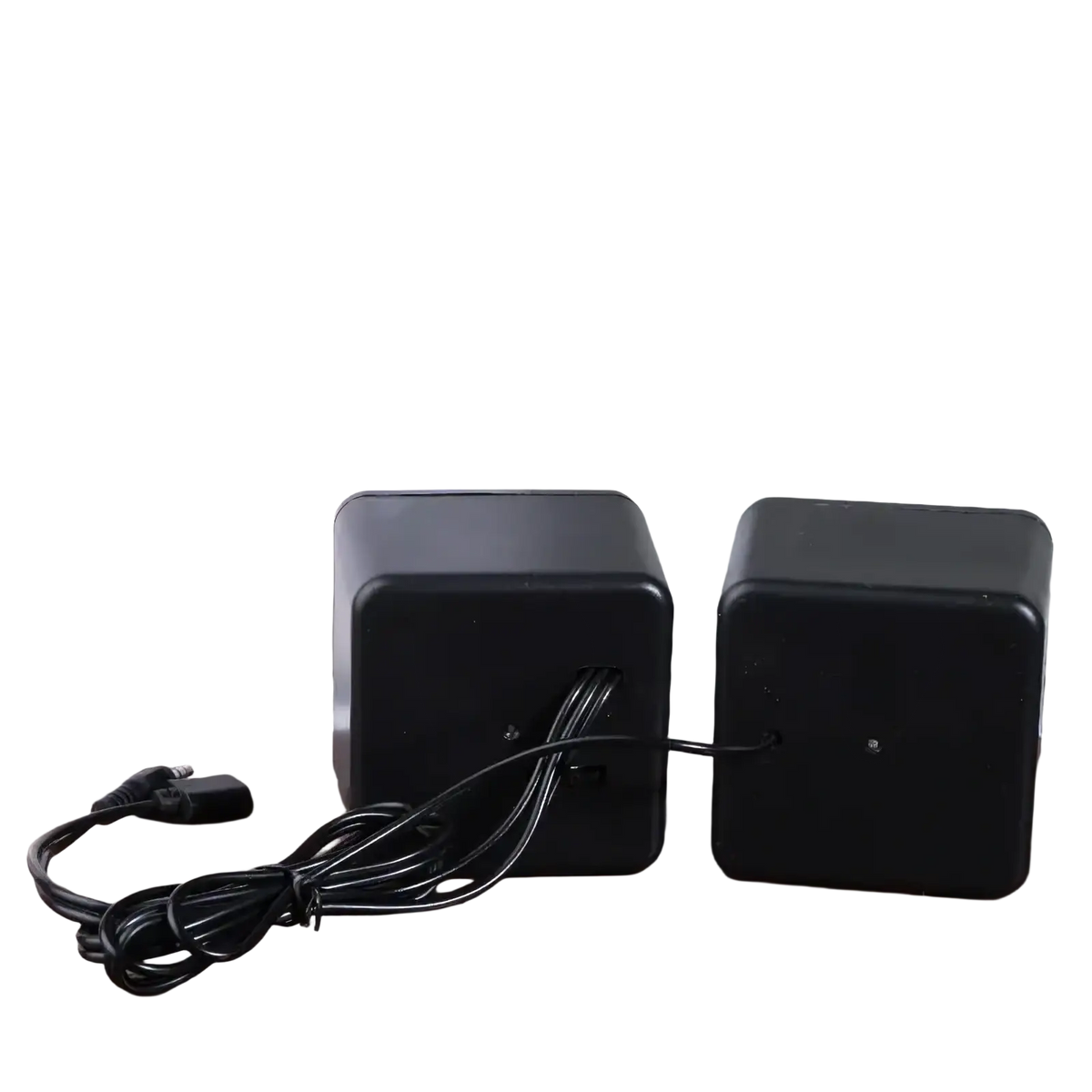 Black cube-shaped usb computer speakers with matte finish featuring led stereo audio and coiled usb cable connection