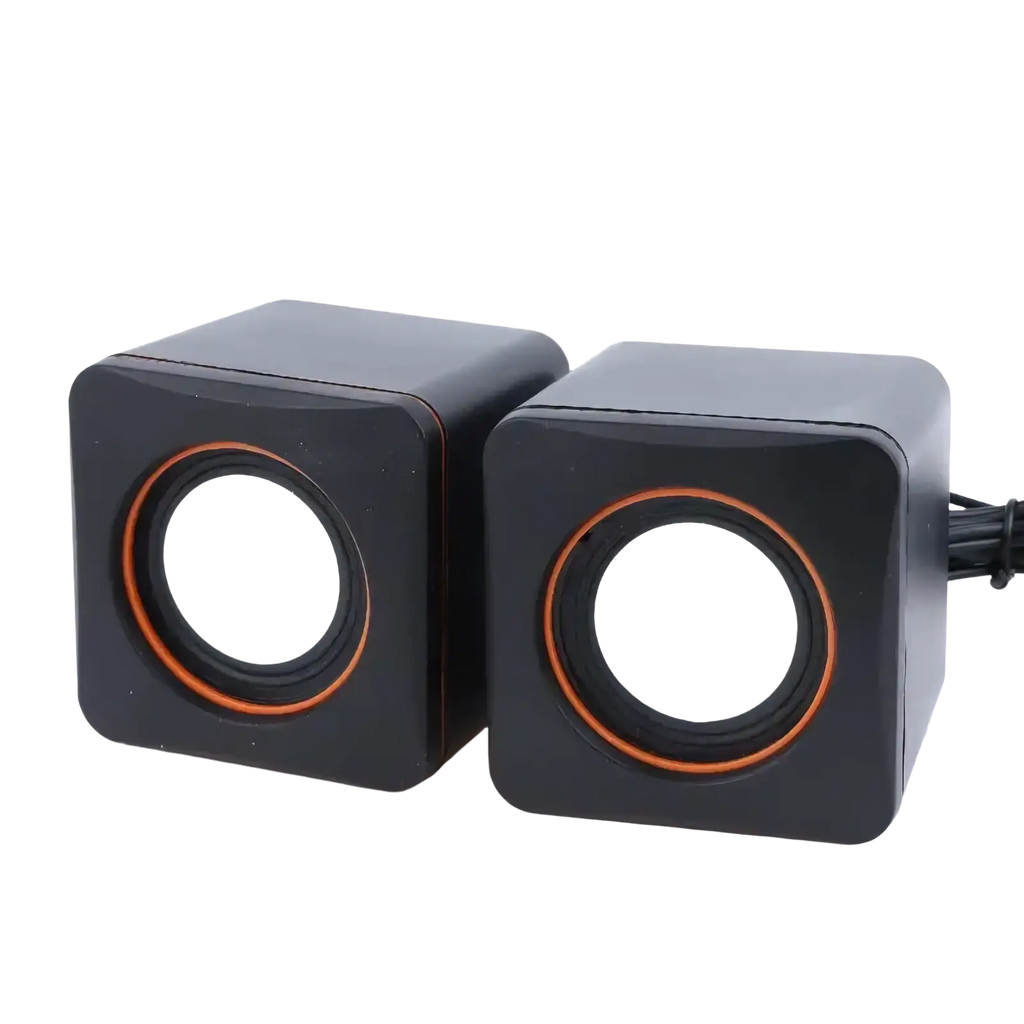 Black cube-shaped usb computer speakers with orange-rimmed drivers and built-in microphone for desktop use