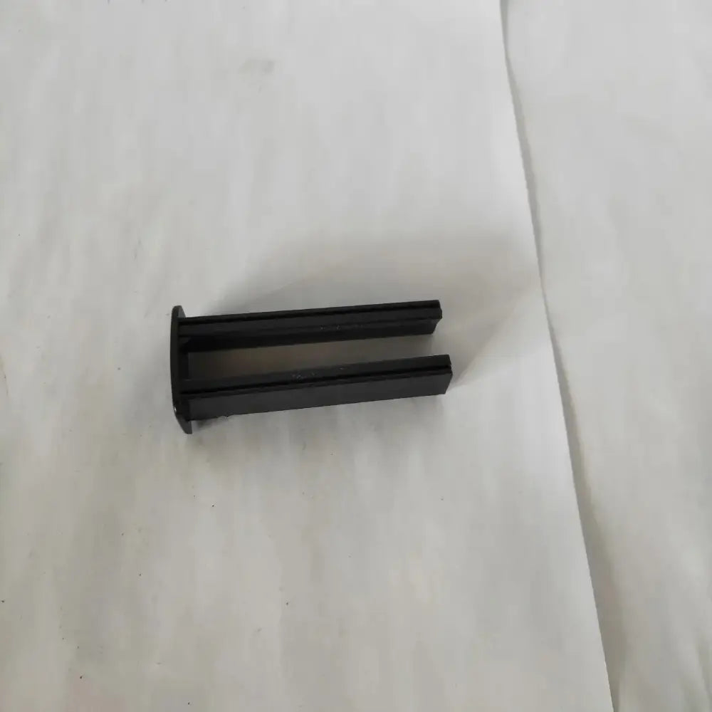 Black plastic u-shaped clip for professional cordless hair clipper with quilted travel case accessory