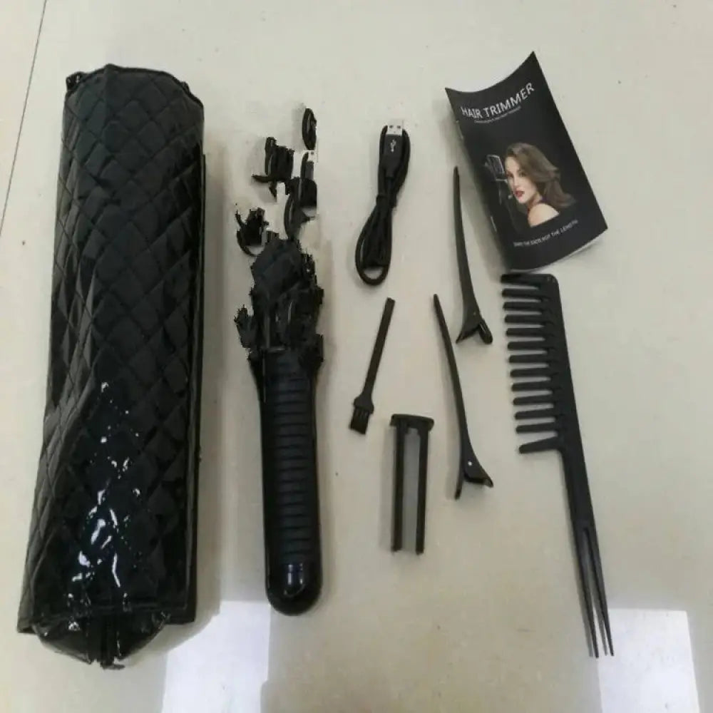 Black plastic professional cordless hair clipper with textured grip and multiple styling attachments in quilted travel case