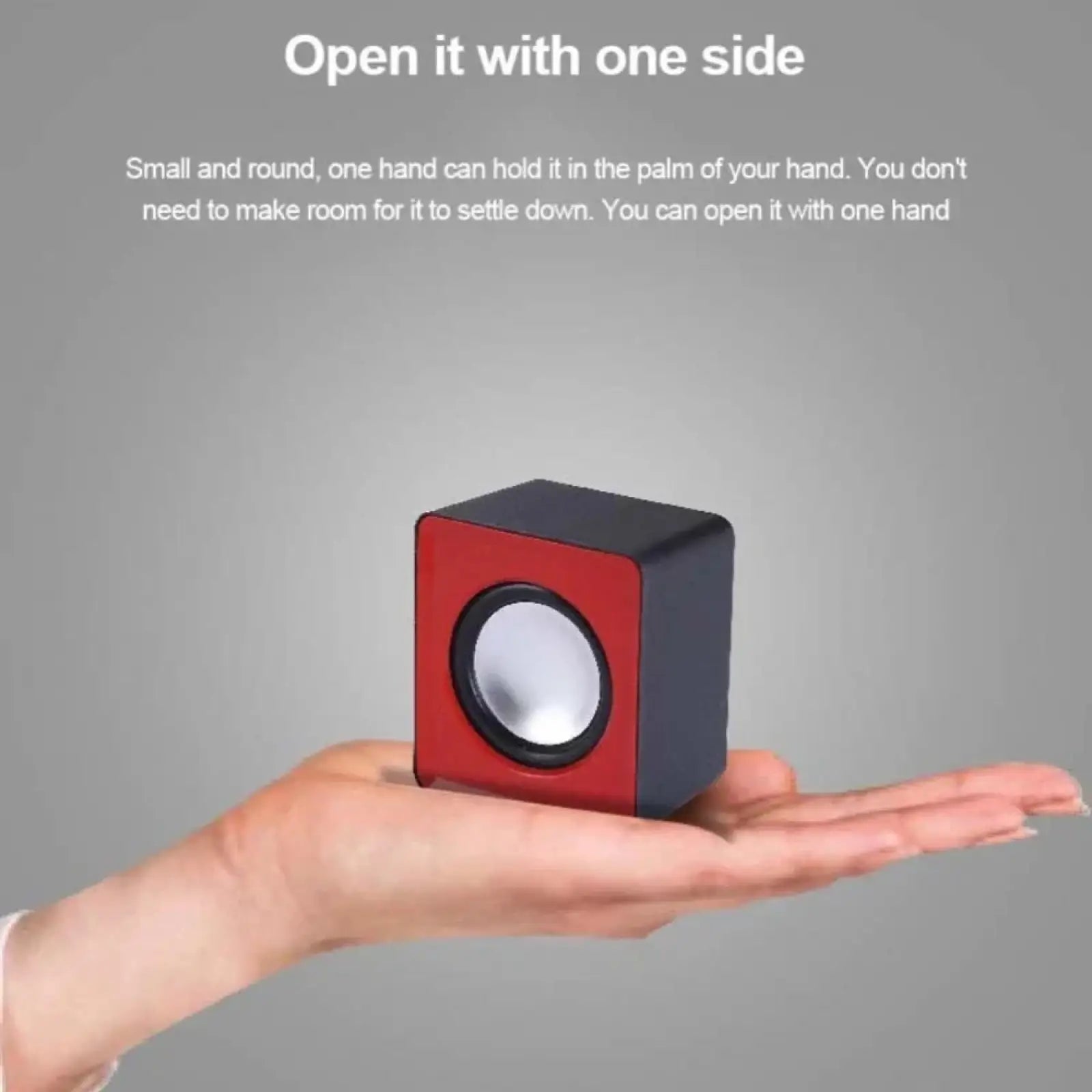 Compact red and black cube-shaped usb mini computer speaker with circular silver driver for desktop stereo audio system