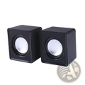 Black cube-shaped USB mini computer speakers with white circular drivers for stereo desktop sound system use