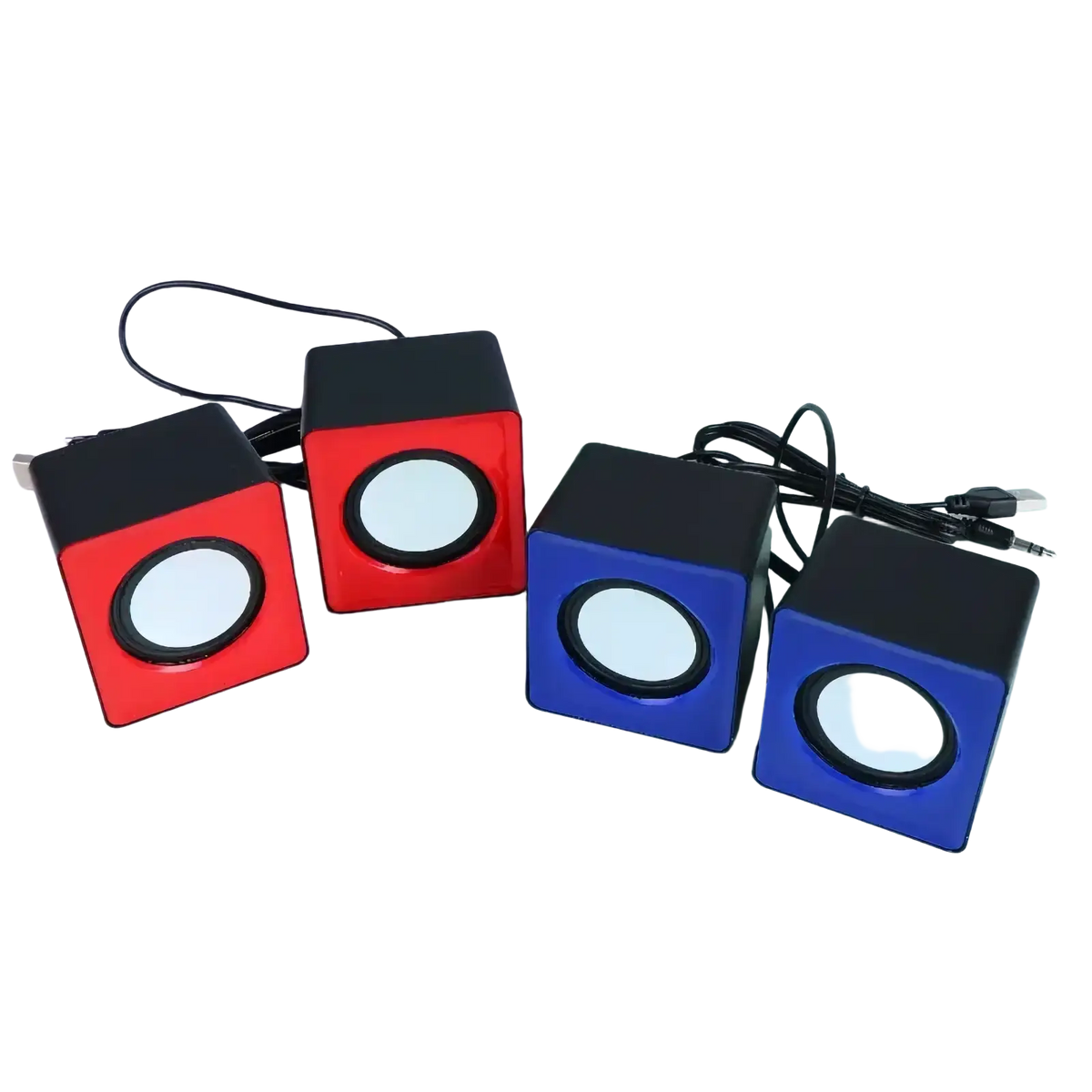 Set of four compact cube-shaped usb mini desktop speakers in red and blue with black tops and white circular drivers