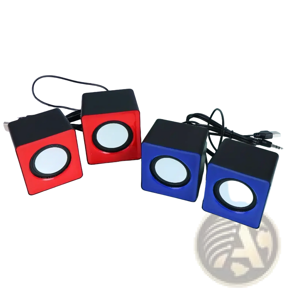 Set of four compact cube-shaped usb mini desktop speakers in red and blue with black tops and white circular drivers