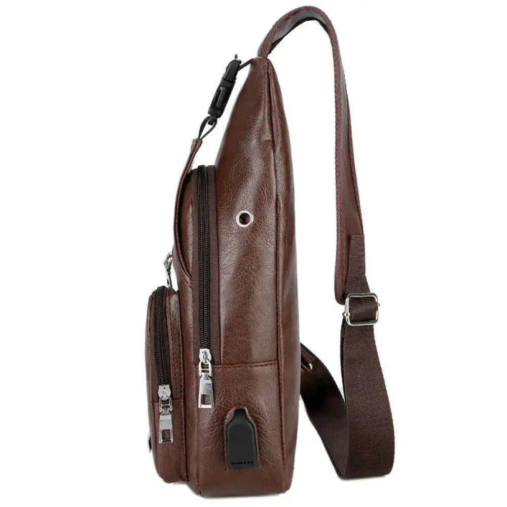 Brown faux leather usb charging chest messenger bag with multiple zippers and adjustable crossbody strap