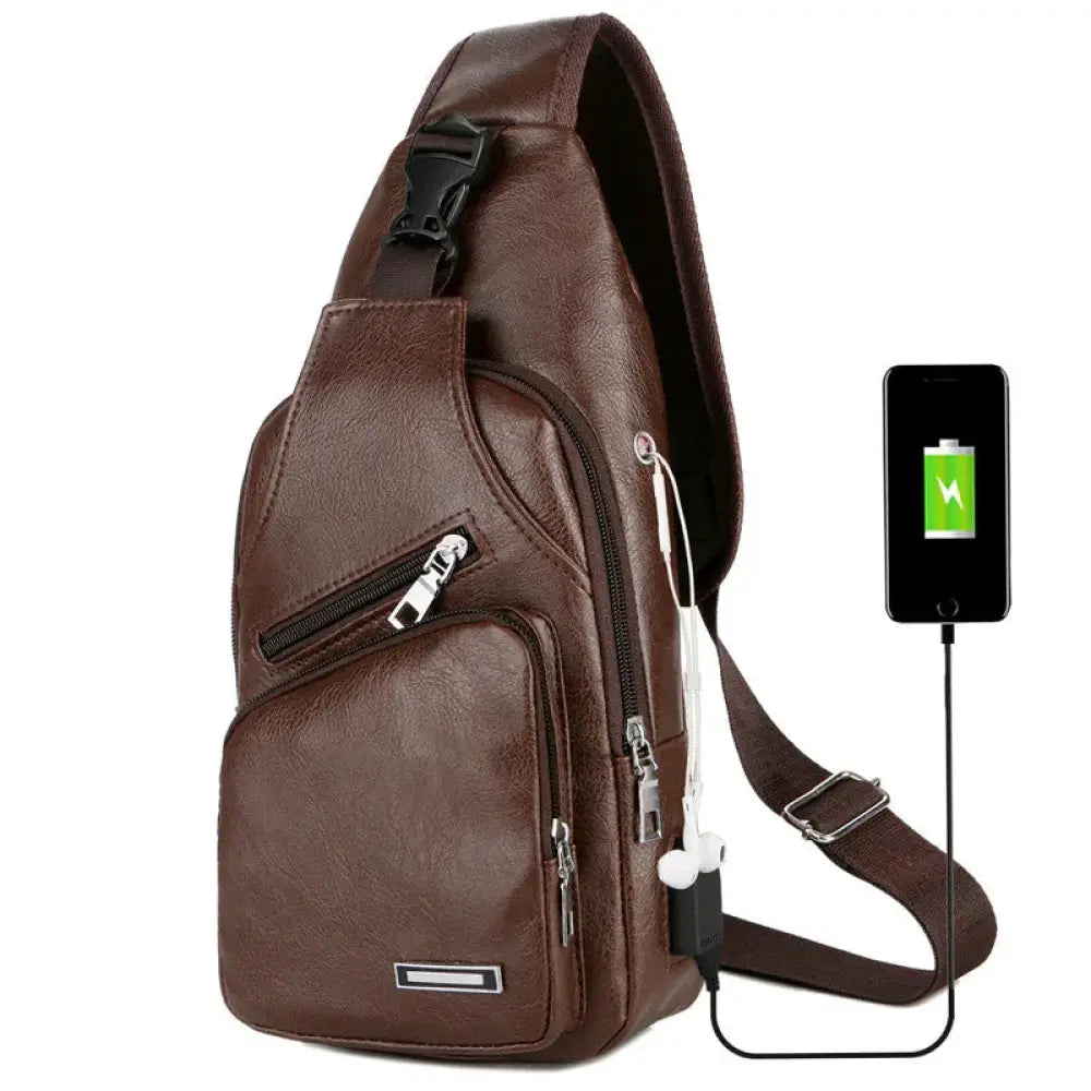 Brown faux leather chest messenger bag with multiple zippers and built-in usb charging port