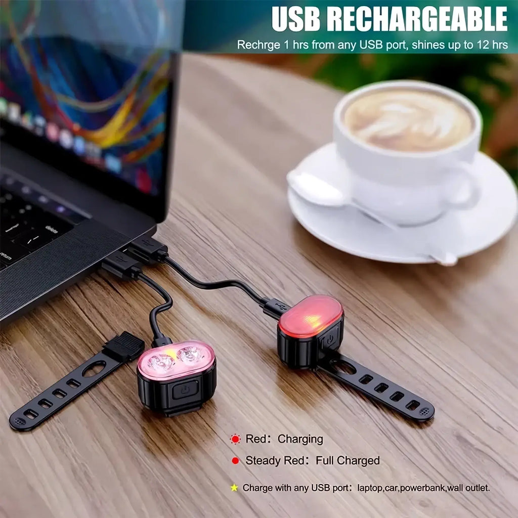 Usb rechargeable led bicycle light set with black plastic housing, red led indicators, dual-lens front headlight, and rear reflector