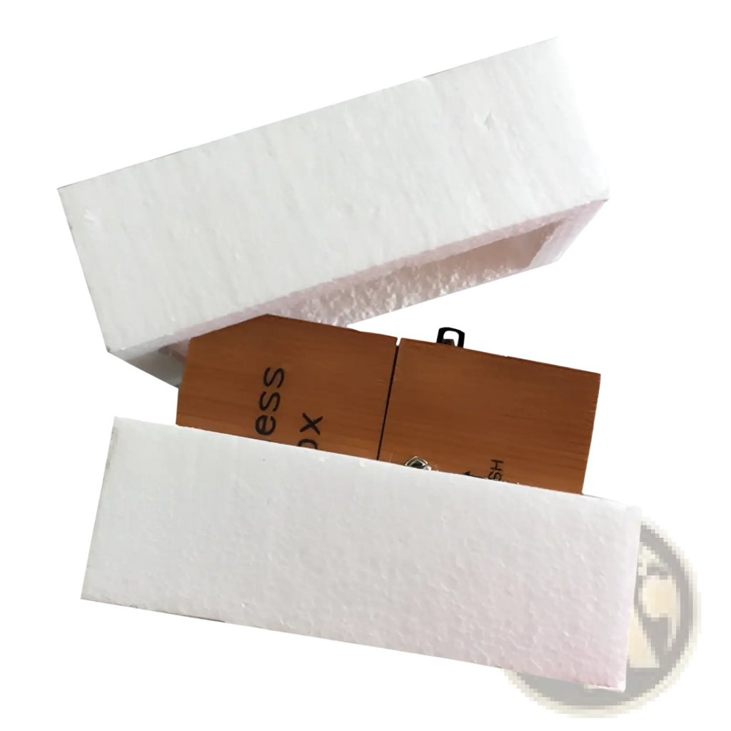 Wooden usb flash drive with natural wood grain finish and minimalist design partially nestled in white foam packaging