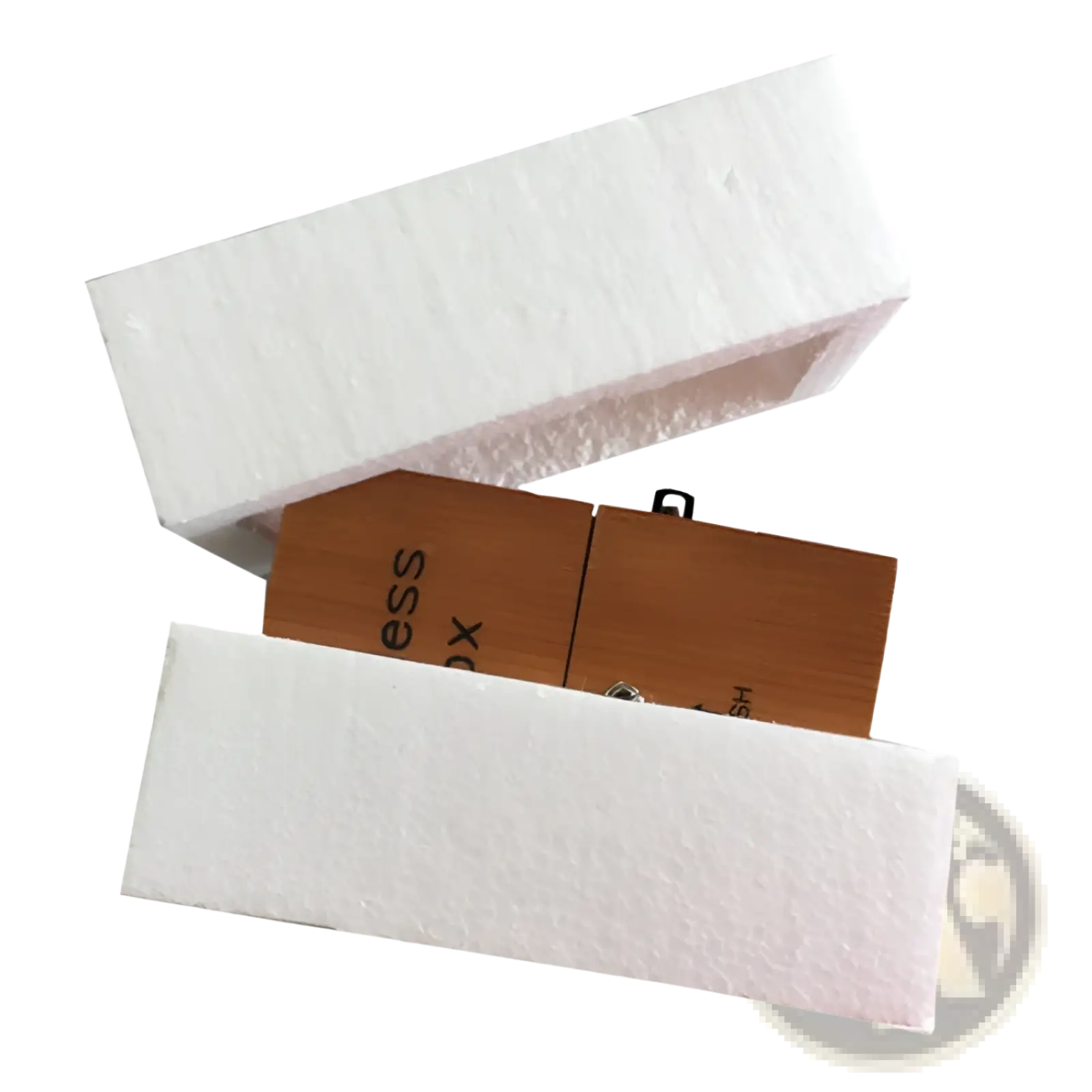 Wooden usb flash drive with natural wood grain finish and minimalist design partially nestled in white foam packaging