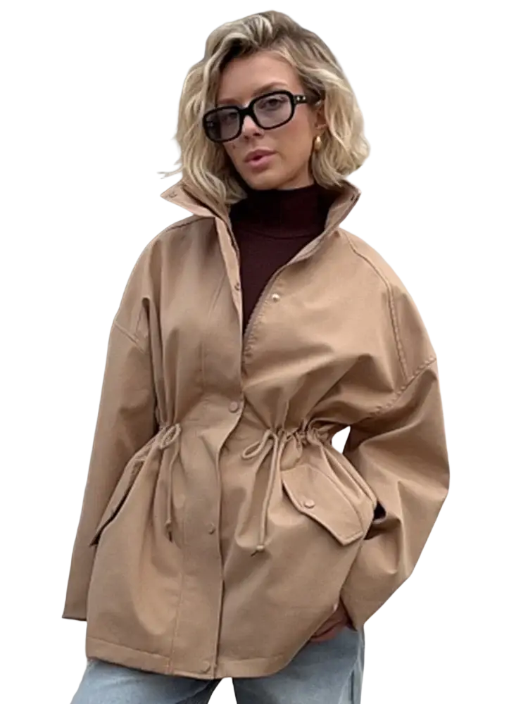 Beige utility trench coat with stand collar, drawstring waist, and flap pockets in a lightweight fabric