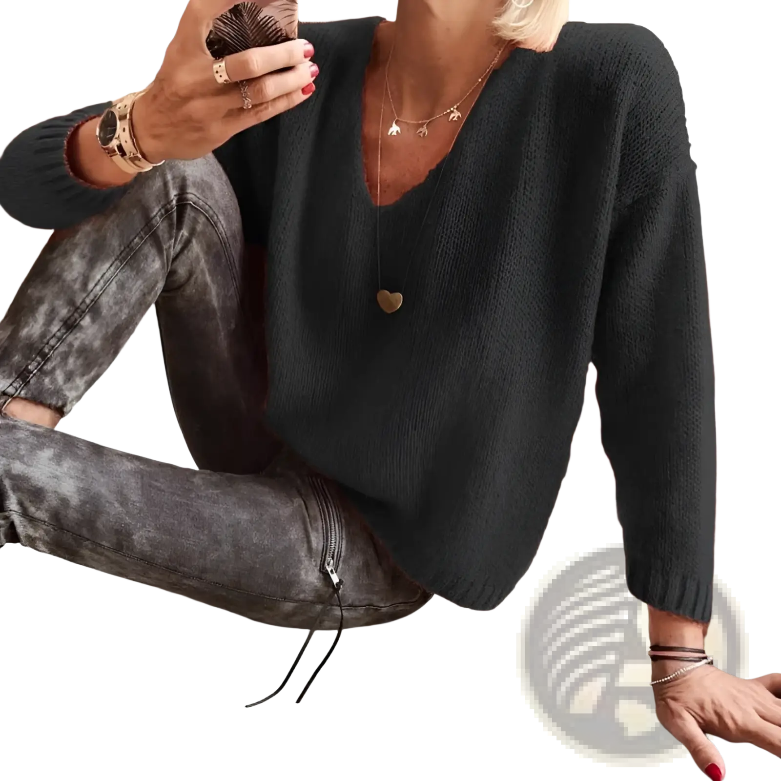 Black textured knit sweater with loose fit v-neckline and drop-shoulder design ideal for casual wear