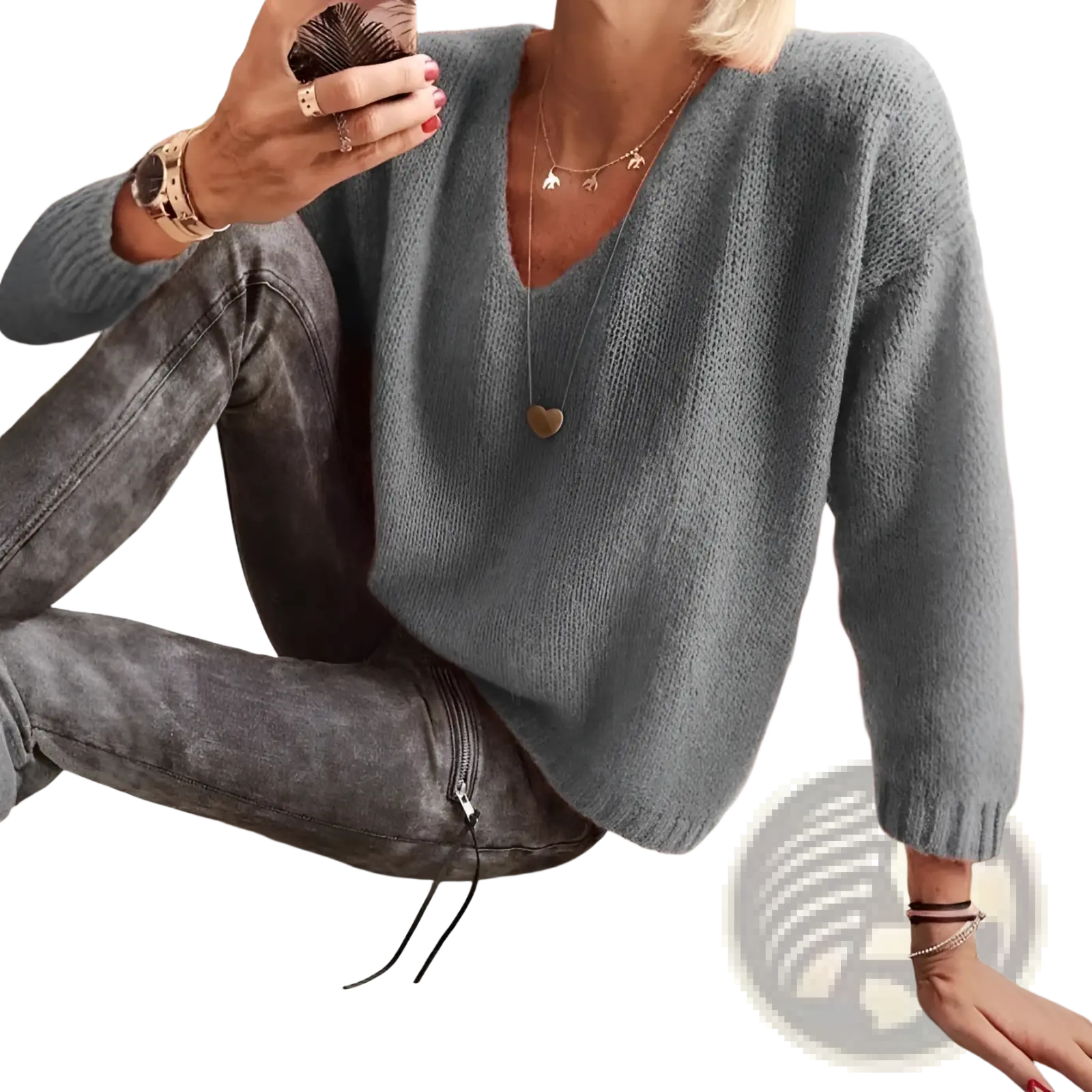 Soft gray v-neck drop-shoulder knit sweater with long sleeves made of comfortable knit material