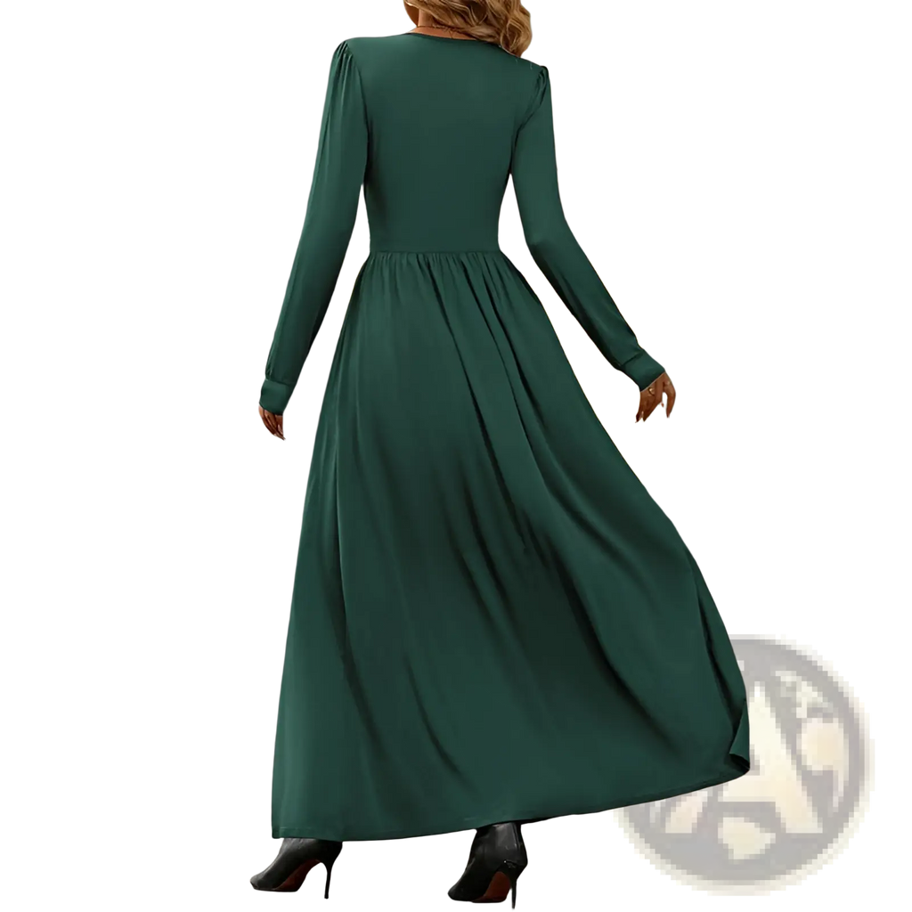 A flowing emerald green v neck long sleeve ruched slit maxi dress with fitted bodice and gathered waist