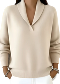 Cream-colored ribbed knit shawl collar sweater with a loose v-neck pullover design in soft knit material