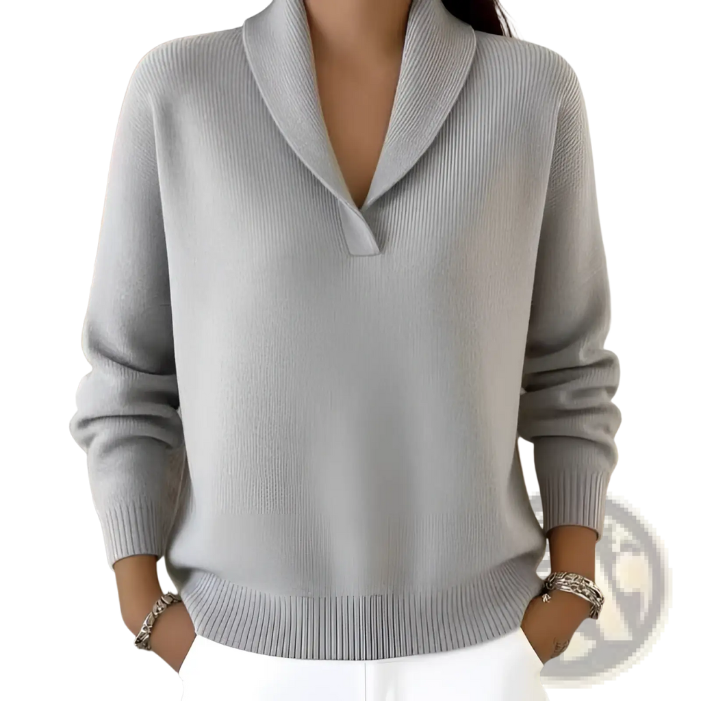 A soft light gray cashmere v-neck loose pullover sweater with a shawl collar ribbed cuffs and hem