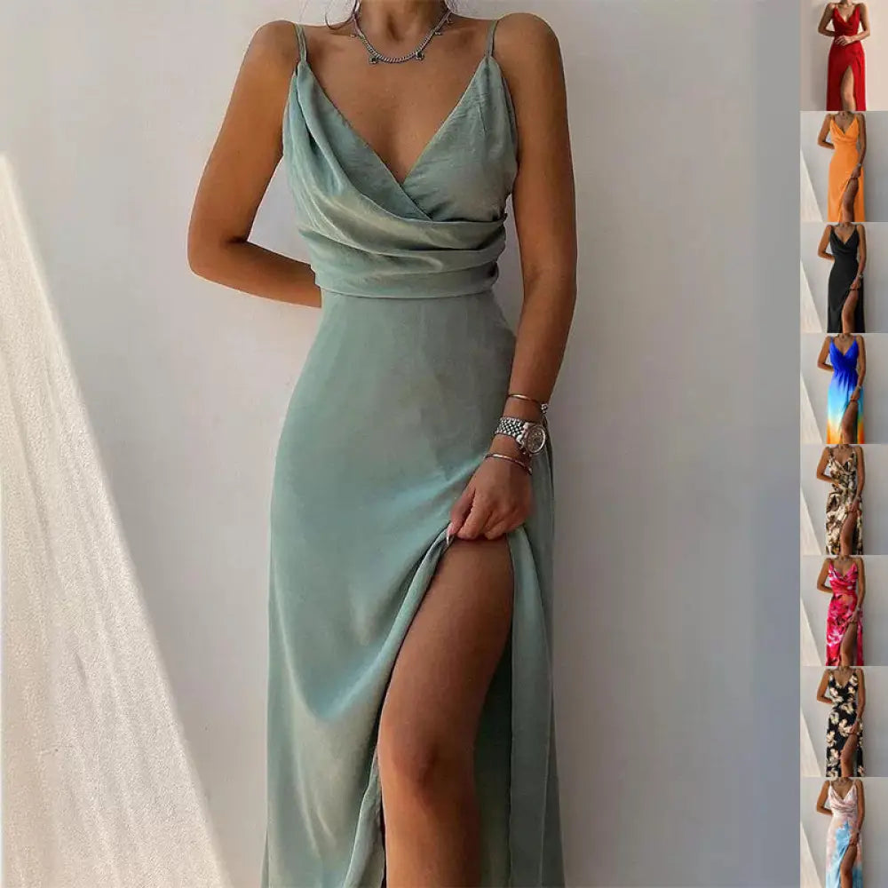 A flowing sage green satin v neck summer maxi dress with a high slit and elegant slip silhouette