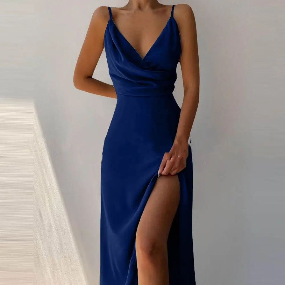A sleek royal blue satin v neck high slit summer maxi dress with thin spaghetti straps and deep v neckline