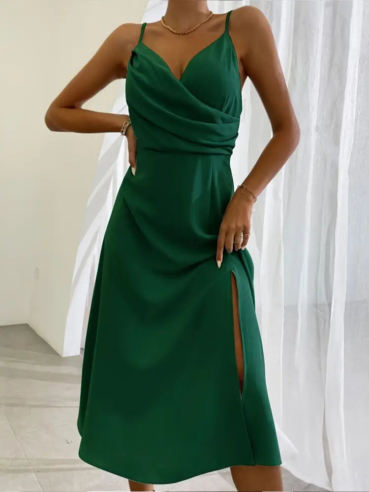 Emerald green satin midi dress with a draped bodice and side slit for elegant summer occasions