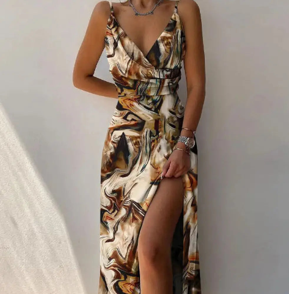 A flowing satin v neck high slit summer maxi dress with an abstract marbled pattern in earthy tones