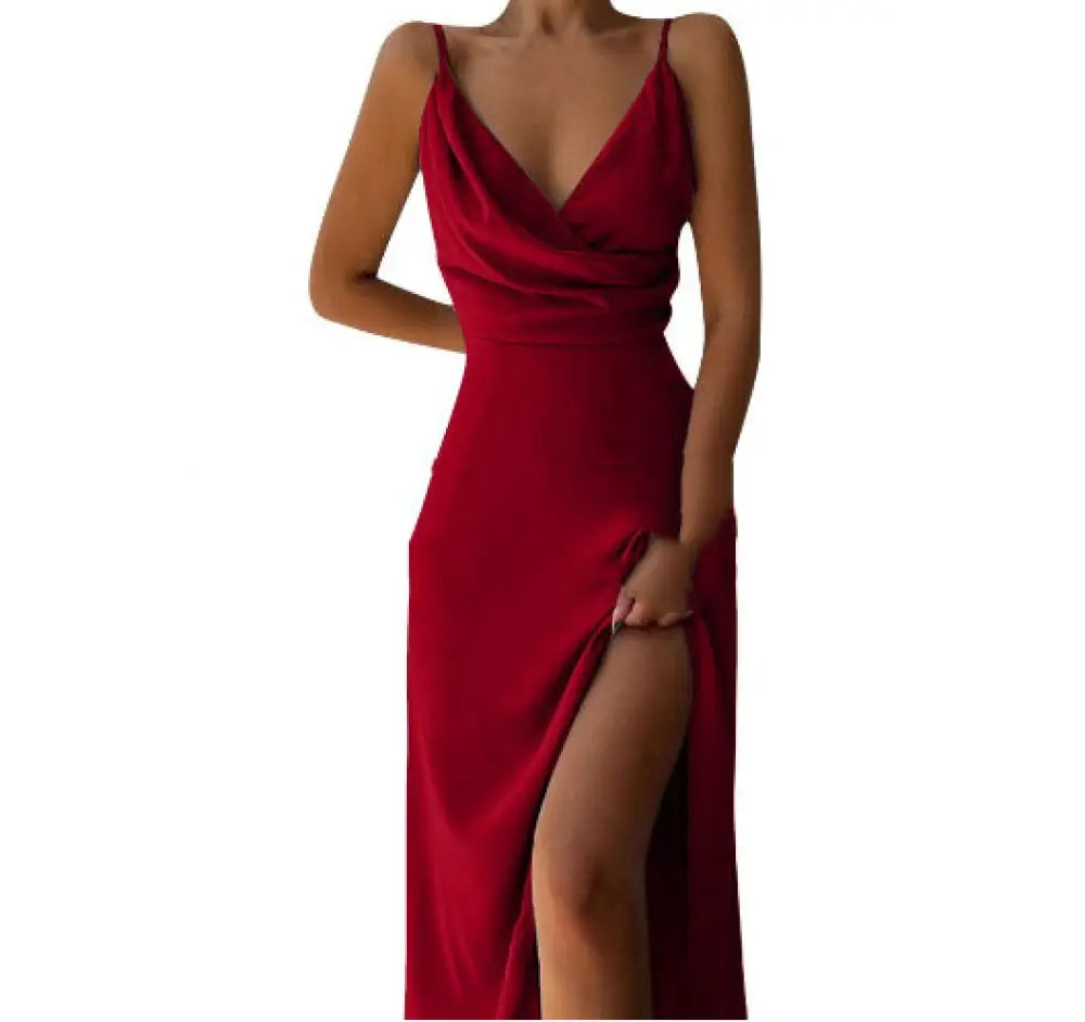A sleek deep red satin v neck high slit summer maxi dress with thin spaghetti straps for elegant evening wear