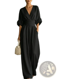 Black v-neck wide-leg jumpsuit with cinched waistband made from lightweight fabric for stylish comfort