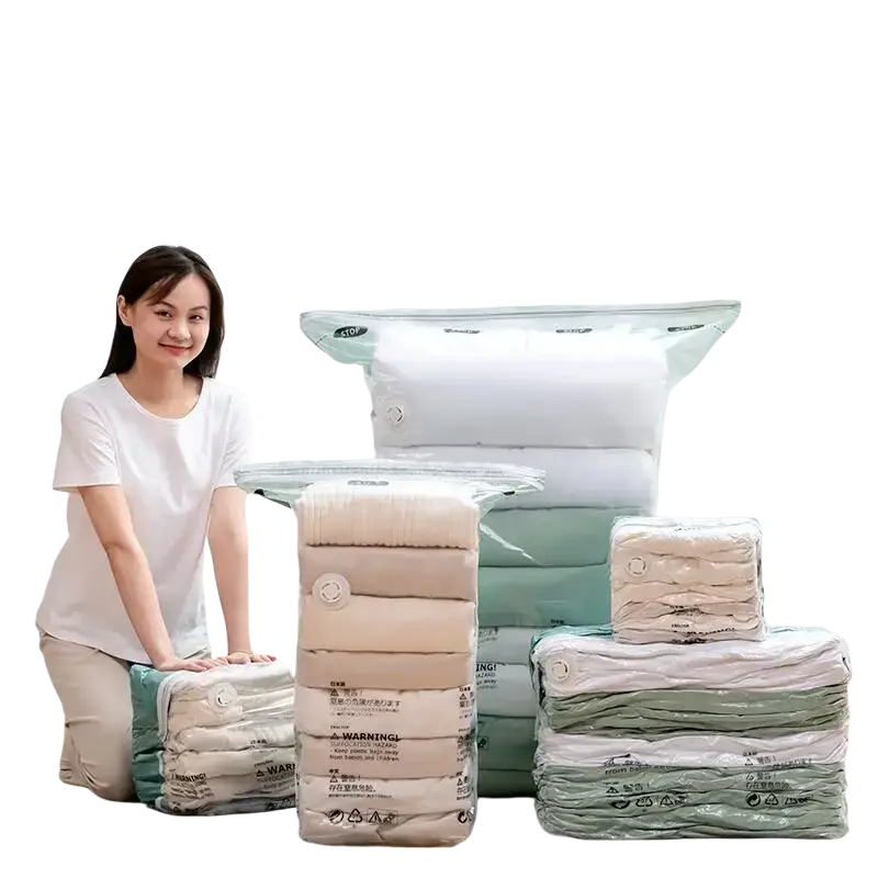 Clear plastic vacuum bags with white circular seals designed for large pump-free storage of clothes