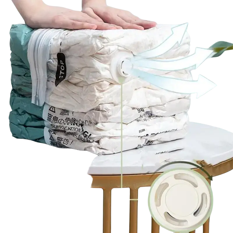Stack of white and teal vacuum bags with circular valve for large pump-free storage of clothes