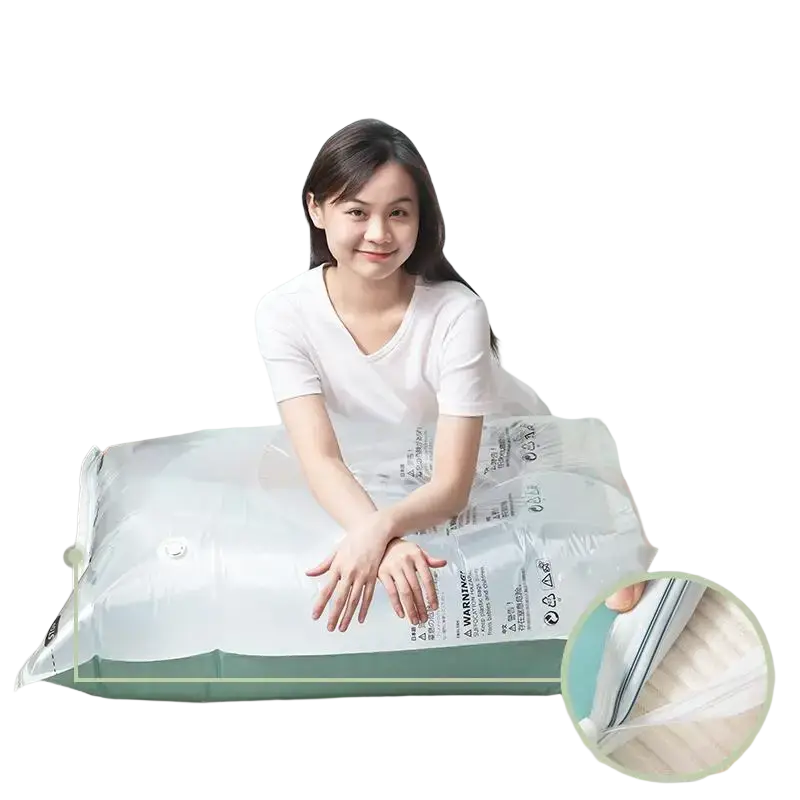 Transparent plastic vacuum bags with green base and zipper closure for large pump-free storage of clothes