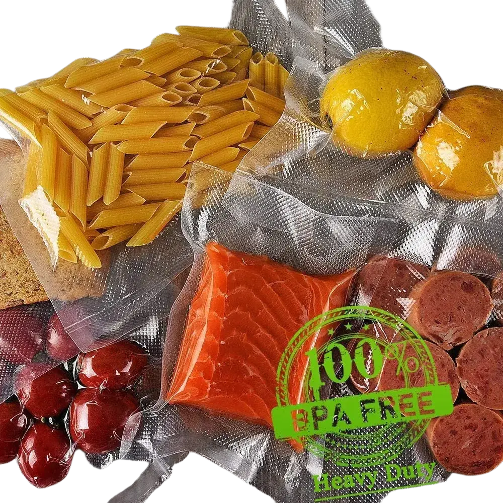 Clear vacuum sealer bags roll containing yellow penne pasta, orange salmon fillet, red cherry tomatoes, and sliced sausage for food vacuum storage
