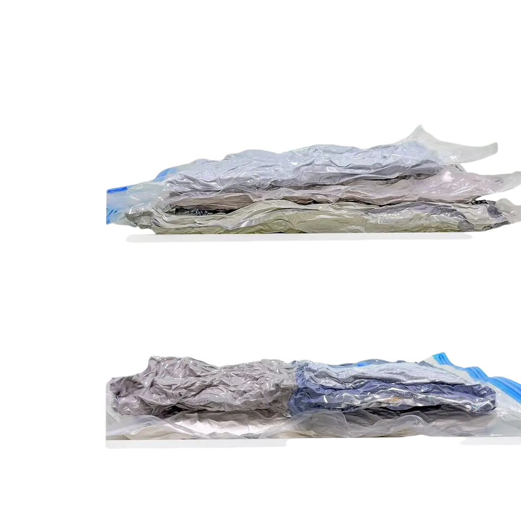 Clear plastic vacuum storage bags with blue sealing strips containing folded clothing for clothes and blankets storage