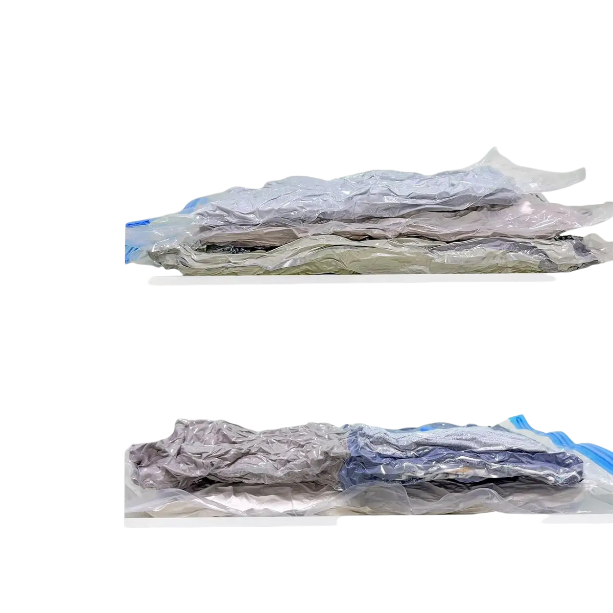 Clear plastic vacuum storage bags with blue sealing strips containing folded clothing for clothes and blankets storage